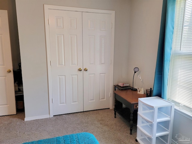 bedroom featuring a closet and carpet floors