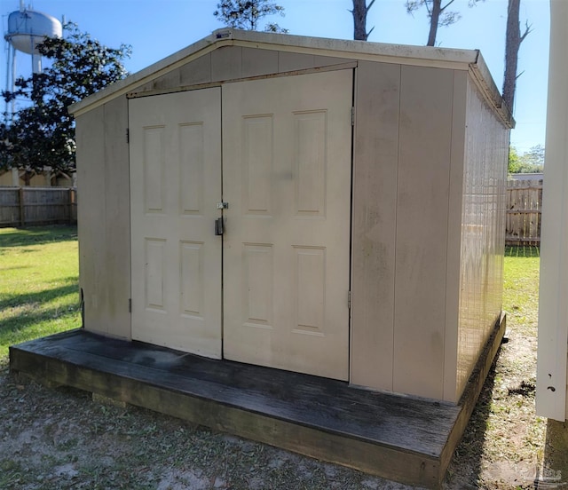 view of shed with fence