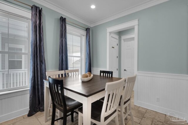 dining room featuring crown molding