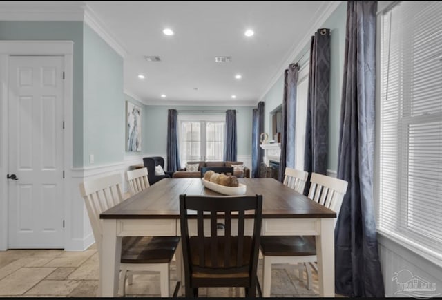 dining area featuring crown molding