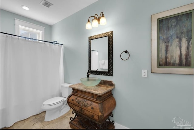 bathroom with vanity and toilet