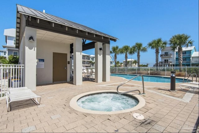 view of swimming pool with a gazebo, a community hot tub, and a patio