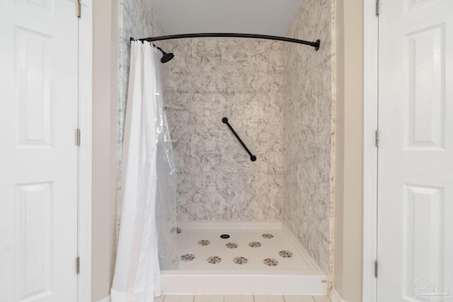 full bath featuring a shower stall