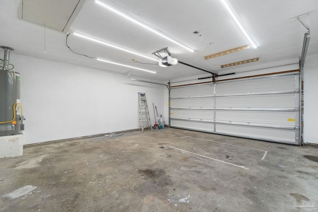 garage with a garage door opener and water heater