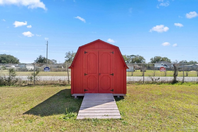 view of shed with fence