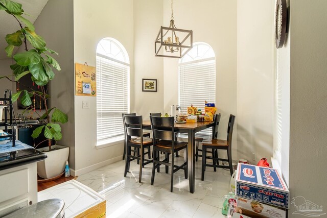 dining room with a notable chandelier