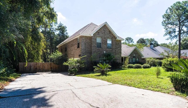 front facade with a front yard