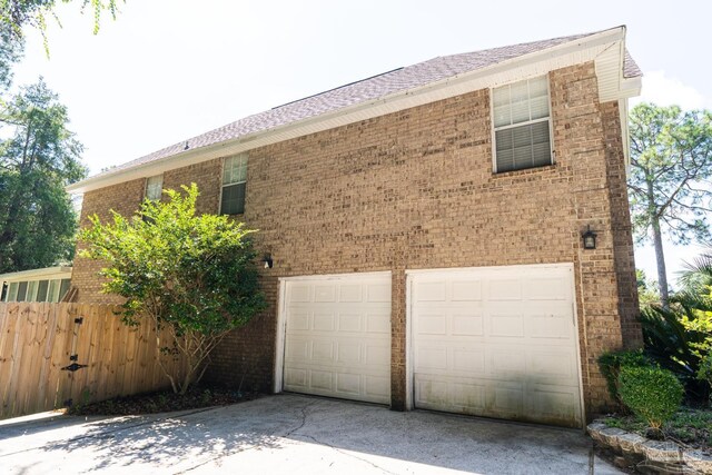 view of property exterior with a garage