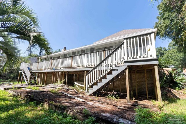 rear view of property with a wooden deck