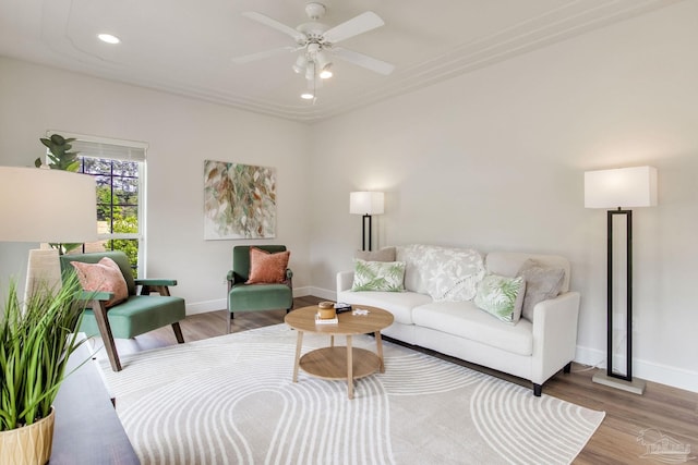 living area with baseboards, recessed lighting, a ceiling fan, and wood finished floors