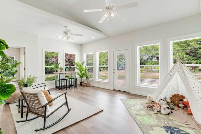 sunroom / solarium featuring recessed lighting and wood finished floors