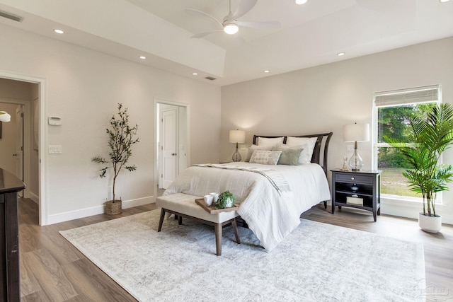 bedroom featuring recessed lighting, baseboards, visible vents, and wood finished floors