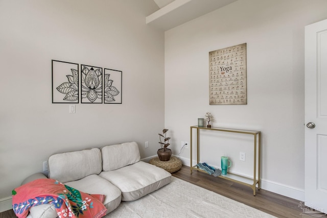 living room with wood finished floors and baseboards
