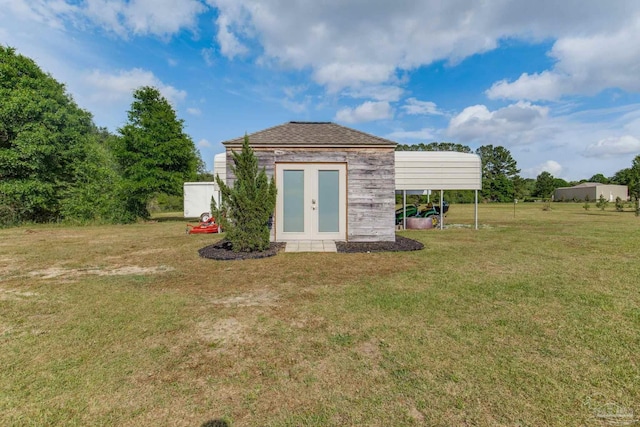 view of outdoor structure with a detached carport
