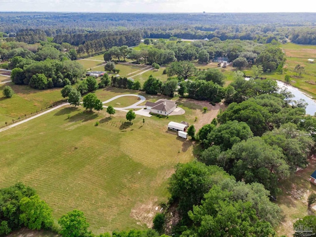 birds eye view of property with a rural view and a water view