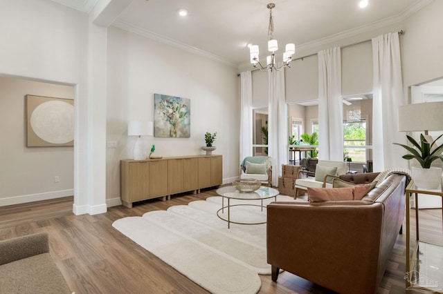 interior space featuring baseboards, ornamental molding, a chandelier, and wood finished floors