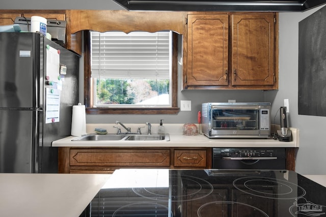 kitchen with sink and black appliances