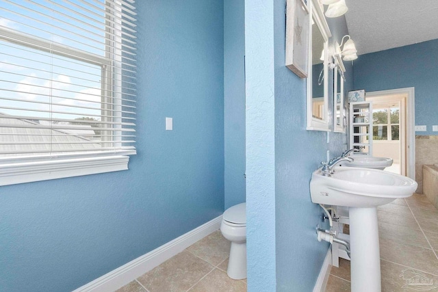 bathroom featuring tile patterned floors and toilet