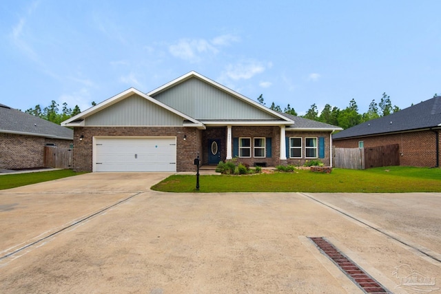 5851 Anderson Ln, Milton, FL 32570 - view of front of home with brick siding, concrete driveway, and a garage