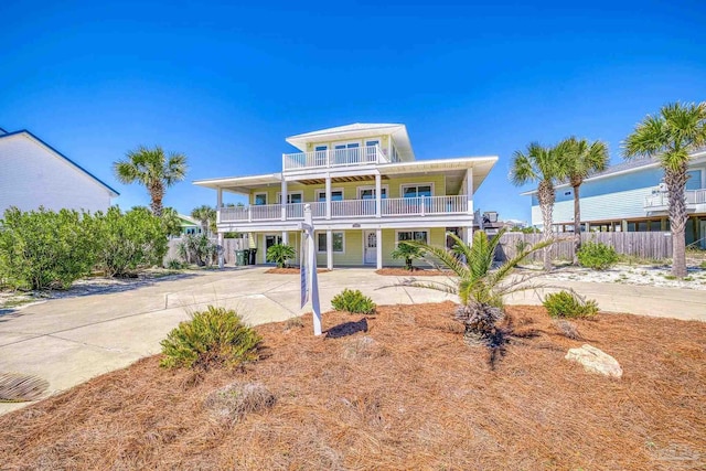 coastal inspired home with a balcony