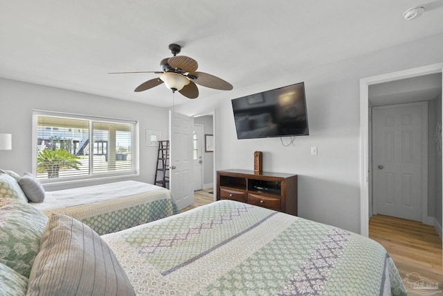 bedroom featuring ceiling fan and hardwood / wood-style flooring