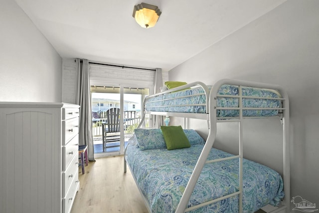 bedroom featuring access to outside and light wood-type flooring