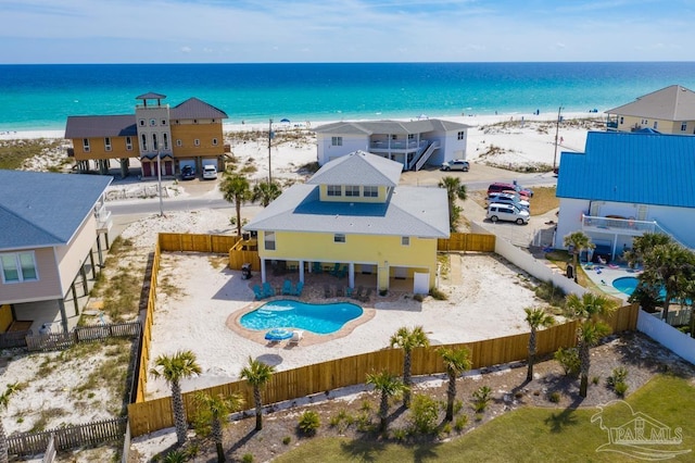 aerial view with a water view and a beach view