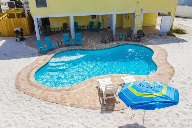 view of swimming pool with a patio