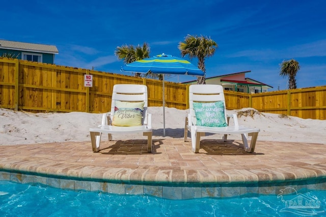 view of swimming pool featuring a patio