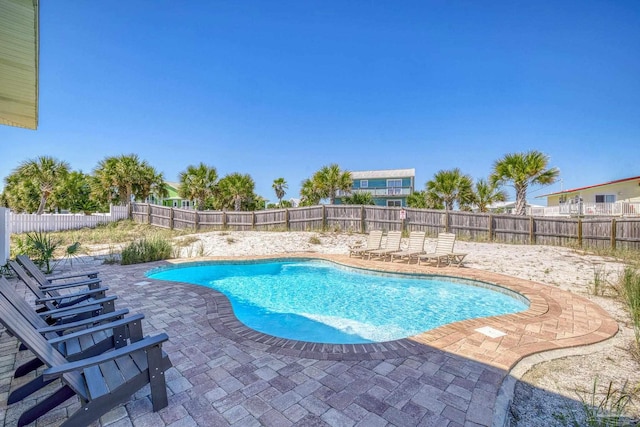 view of swimming pool with a patio area