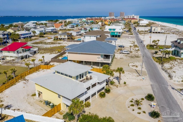 aerial view featuring a water view and a beach view