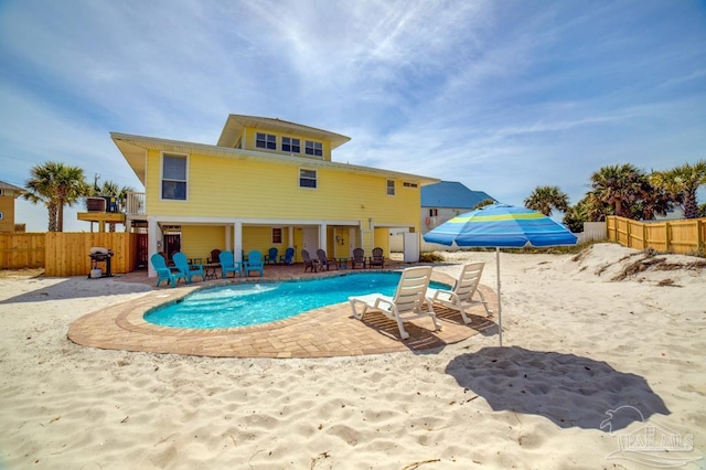 view of pool with a patio area and area for grilling