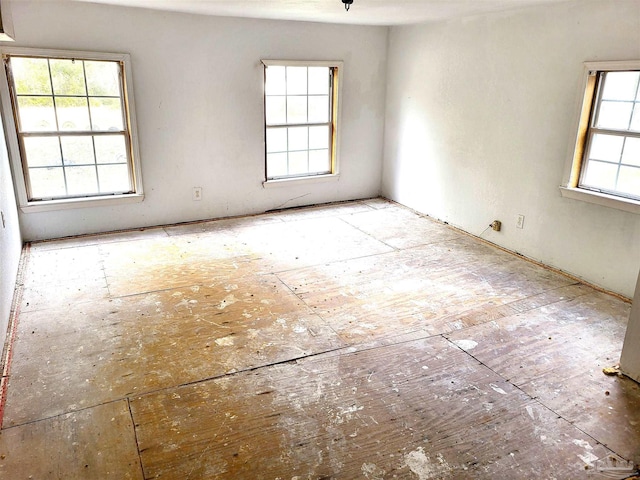 spare room with plenty of natural light