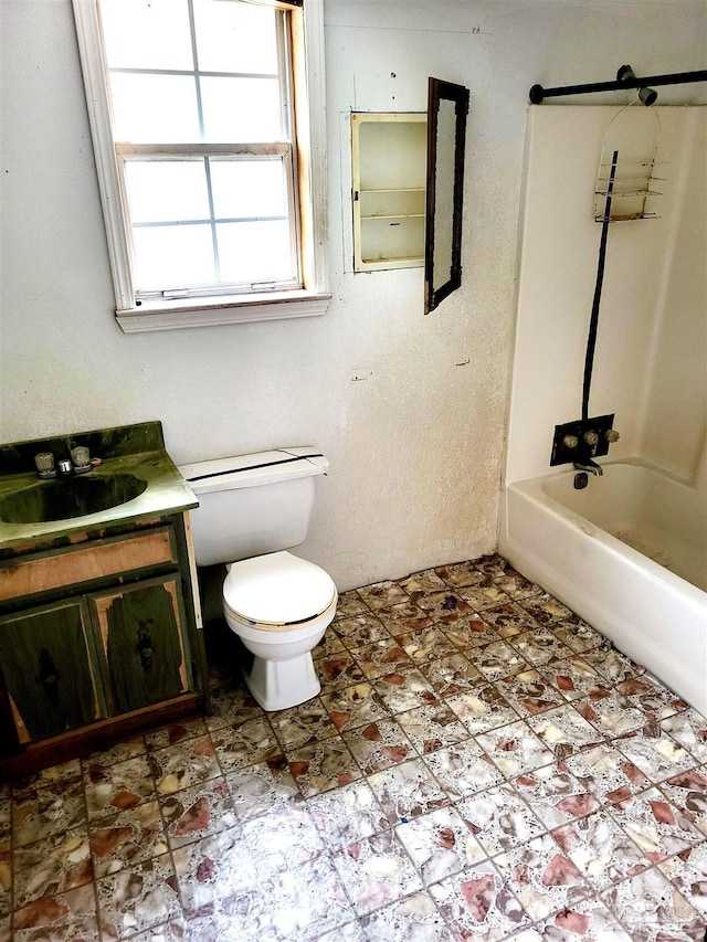 full bathroom featuring shower / bathing tub combination, toilet, and vanity