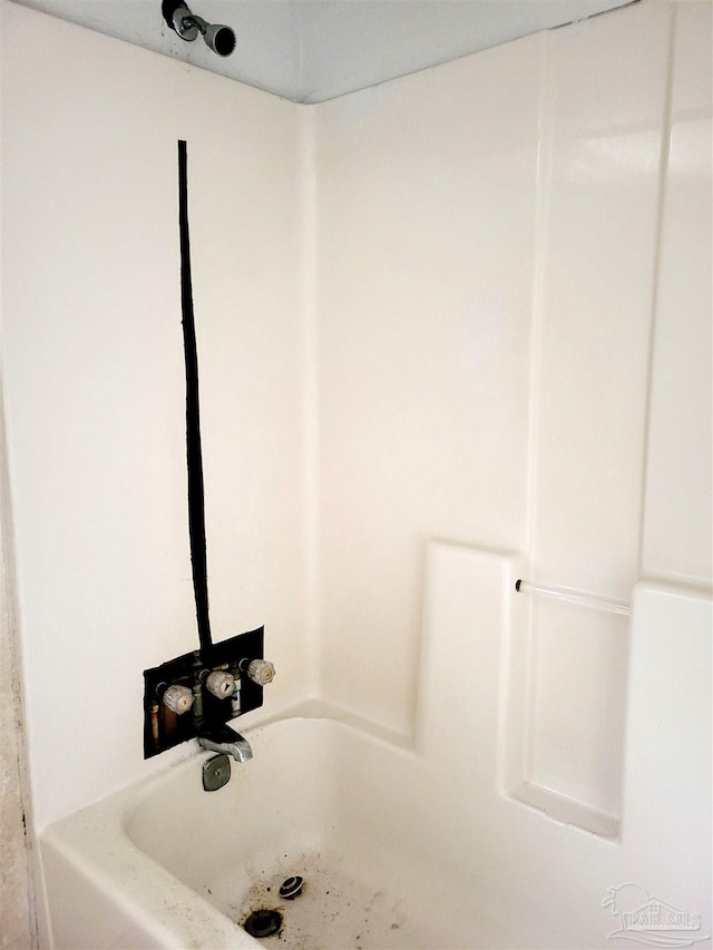 bathroom featuring a tub to relax in