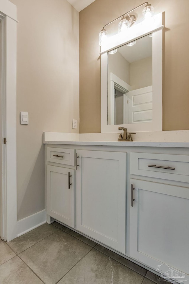 bathroom featuring tile patterned flooring and vanity