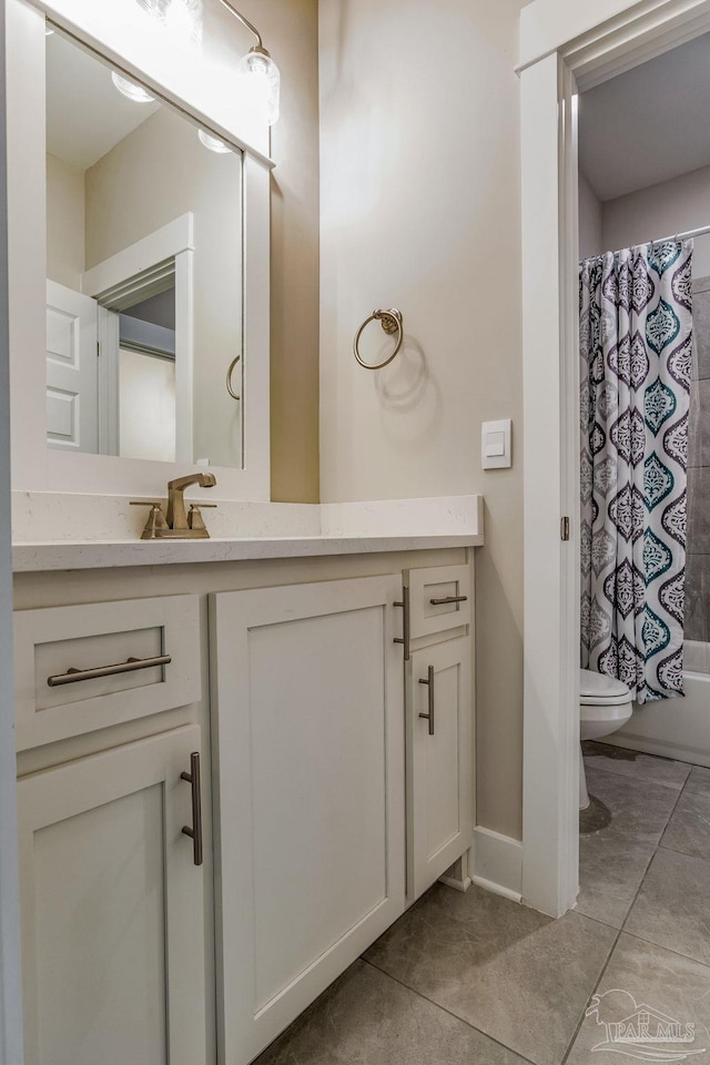 full bathroom featuring toilet, shower / tub combo, vanity, and tile patterned floors