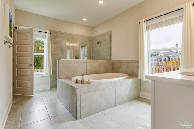 bathroom featuring tile patterned flooring, vanity, and independent shower and bath