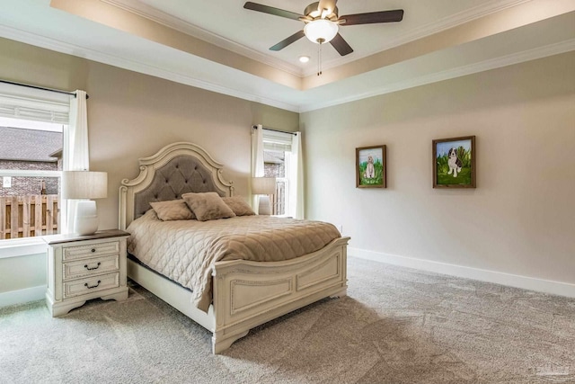 carpeted bedroom with ornamental molding, multiple windows, and ceiling fan