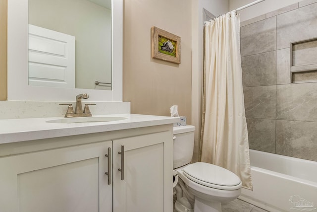 full bathroom featuring vanity, shower / bath combo with shower curtain, and toilet