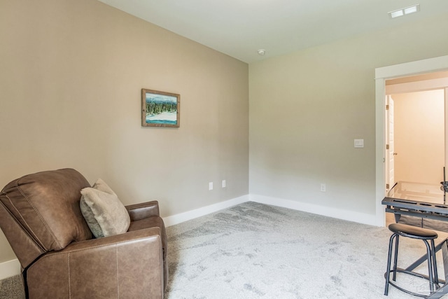 living area with carpet flooring