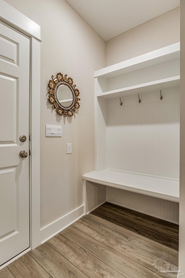 mudroom with wood-type flooring