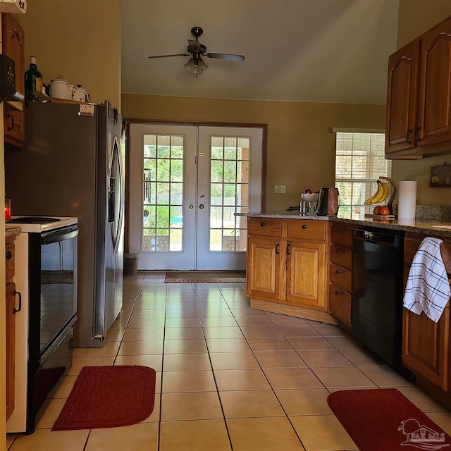 kitchen featuring black appliances, a ceiling fan, french doors, a peninsula, and light tile patterned floors