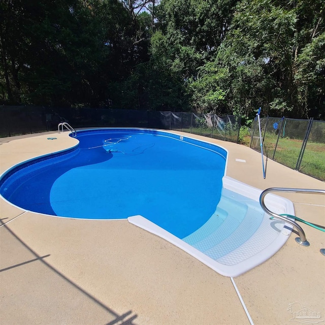 view of swimming pool with a fenced in pool and a fenced backyard