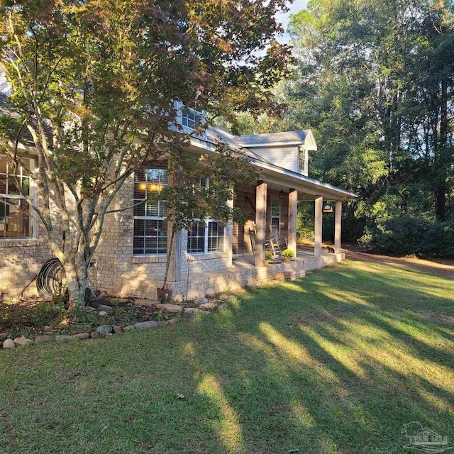 view of property exterior with a lawn