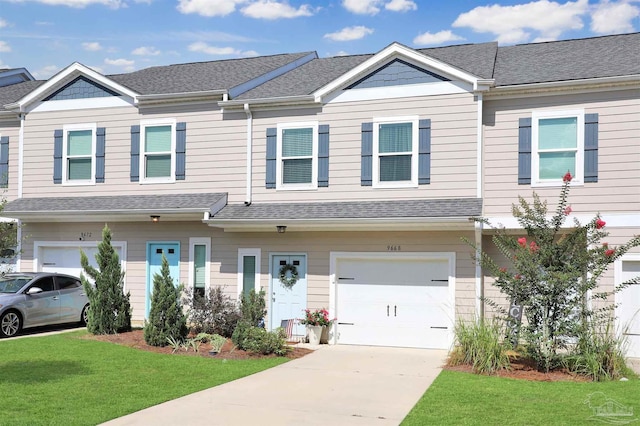 9668 Nature Creek Blvd, Pensacola, FL 32526 - townhome / multi-family property with an attached garage, a front lawn, driveway, and roof with shingles