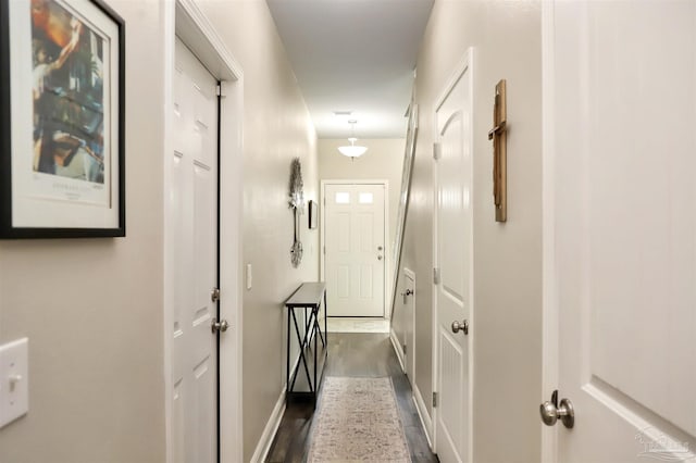 9668 Nature Creek Blvd, Pensacola, FL 32526 - hallway featuring dark wood finished floors and baseboards