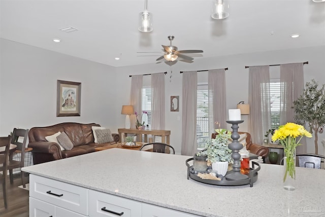 9668 Nature Creek Blvd, Pensacola, FL 32526 - kitchen featuring a ceiling fan, light stone countertops, white cabinets, and recessed lighting