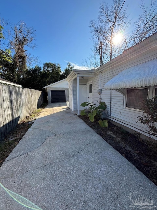 view of side of property with a garage