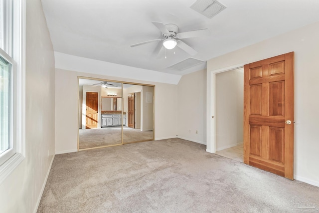 empty room featuring baseboards, visible vents, ceiling fan, and carpet flooring